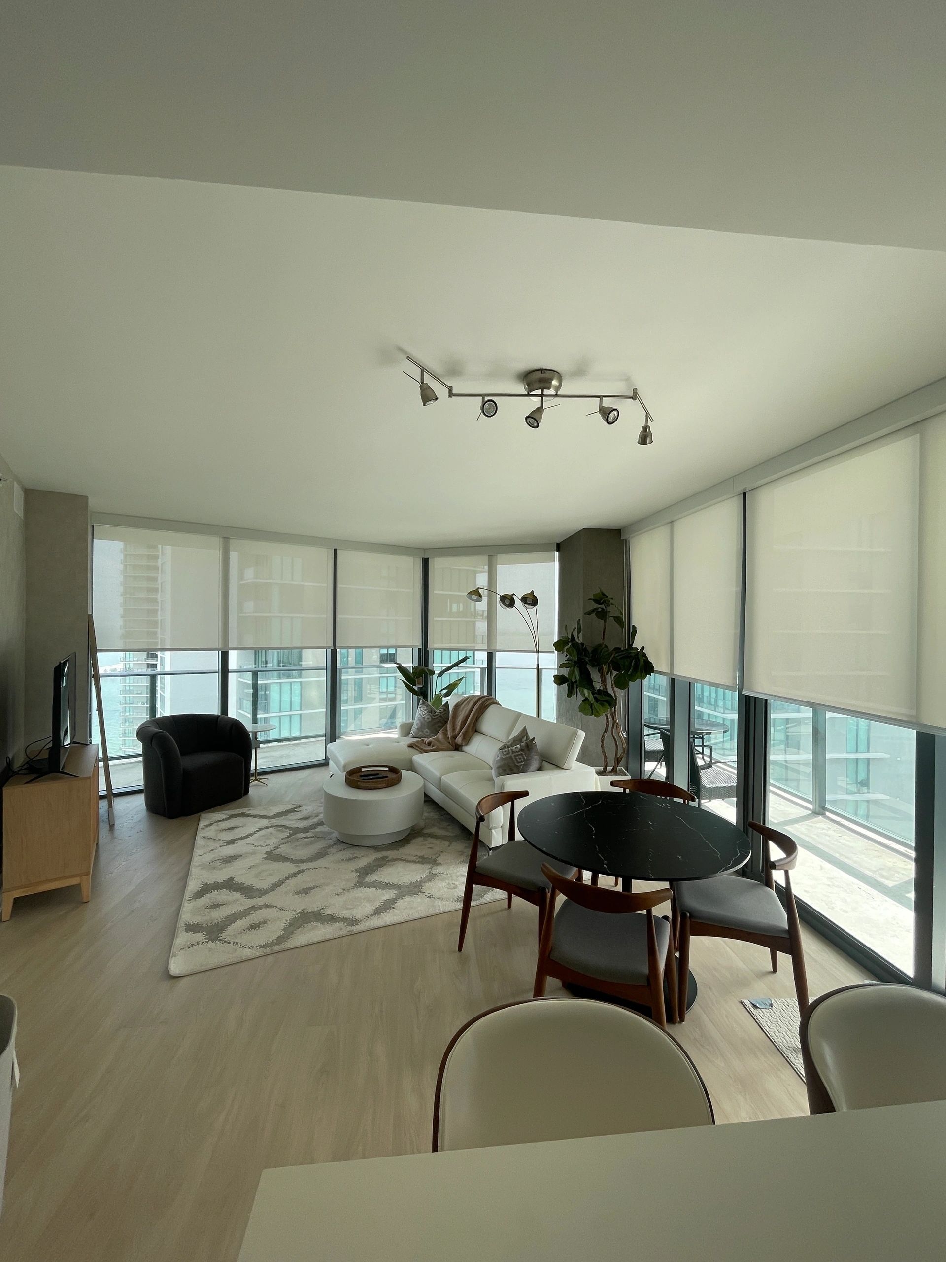 Modern high-rise apartment living and dining area