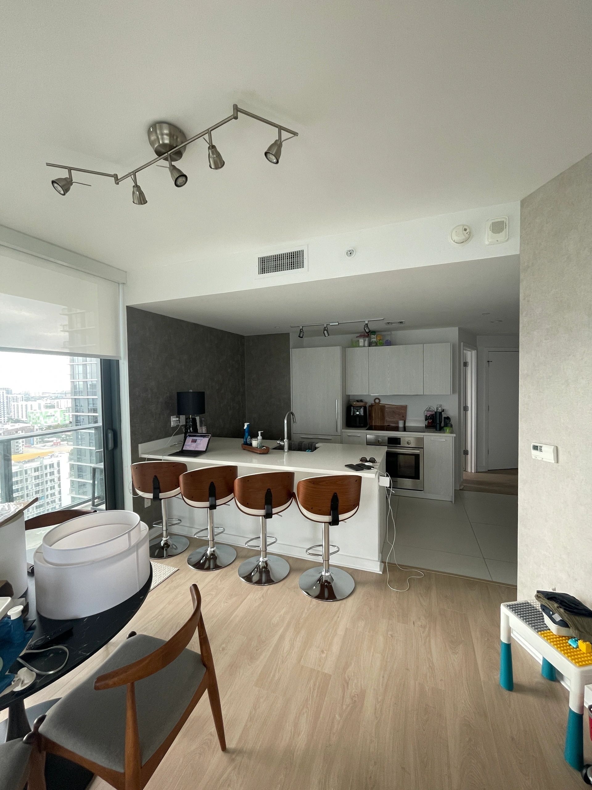Modern high-rise apartment kitchen with city views