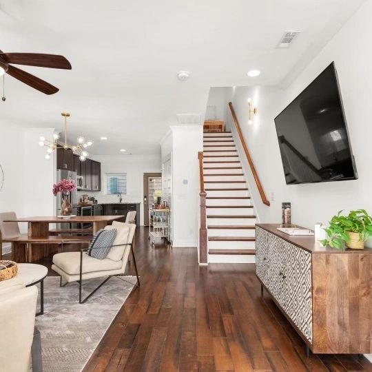 Open concept home interior with staircase and living kitchen